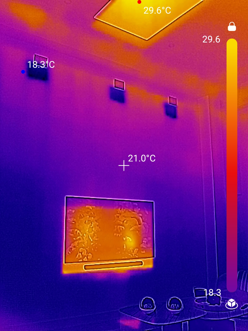 Thermal imaging camera revealing hidden moisture behind walls during inspection